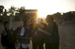 Nikarika, 17, (in red sweatshirt and yellow headband) cheers on her friends playing kabaddi near the Veerni Institute  