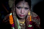 13 year old Runa Akhter is seen the day of her wedding to a 29 year old man August 29, 2014 in Manikganj, Bangladesh. Runa was in the 7th grade, and loved reading, sports and traveling. She wanted to wait until she was 21 to get married but, {quote}No boy want's to marry a girl older than 18 in my village{quote} she said. 