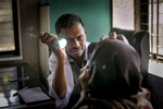 Dr Asif Hannan checks patients during an eye health screening in Sharsha upazila of Jessore district February 26, 2017 in Khulna division, Bangladesh. © Sightsavers/Allison Joyce 