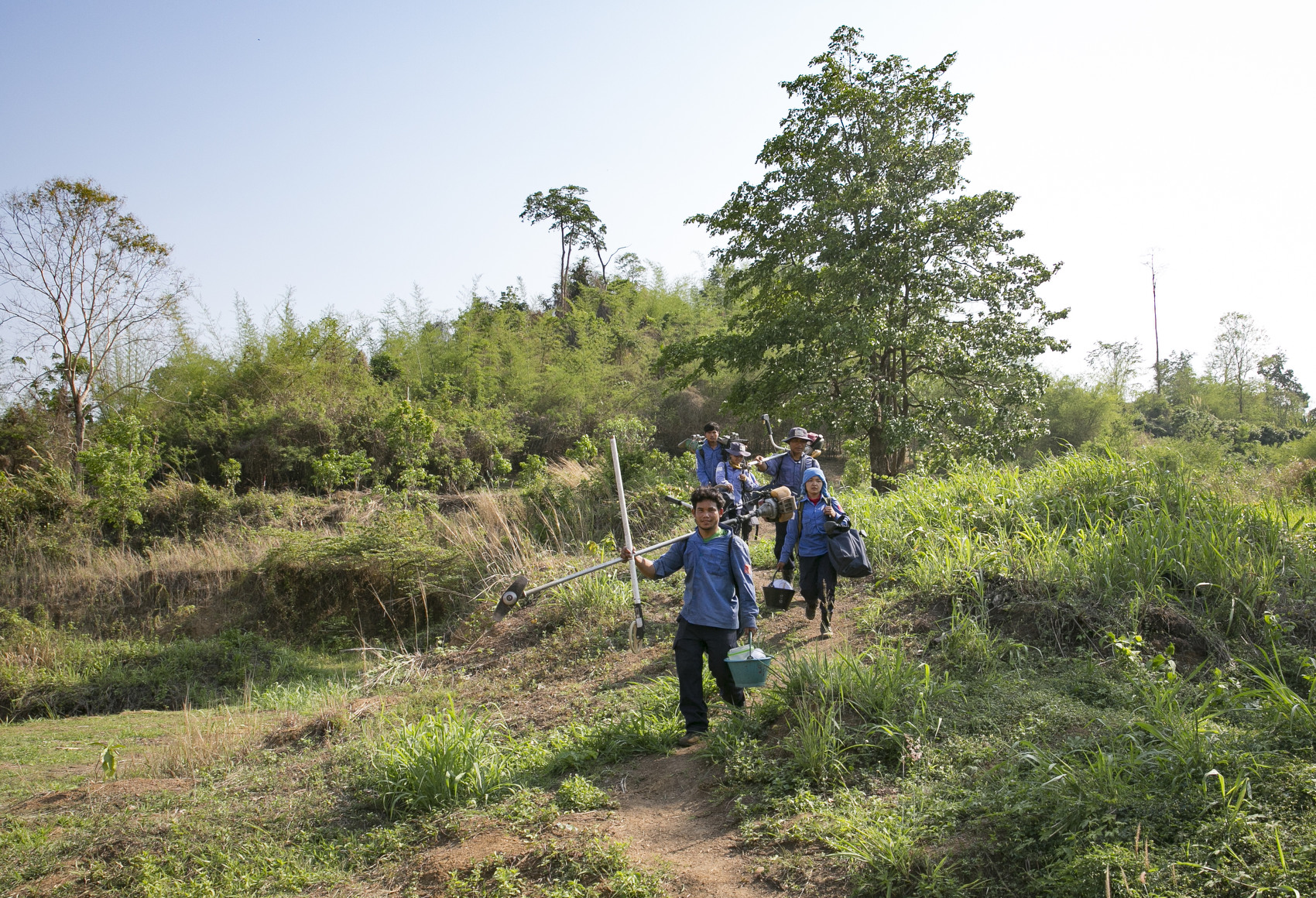 The team exits the field March 30, 2019 in Kamrieng , Cambodia.
