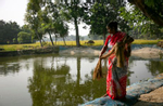 Sahina Khatum works on their fish farm in Mymensingh, Bangladesh