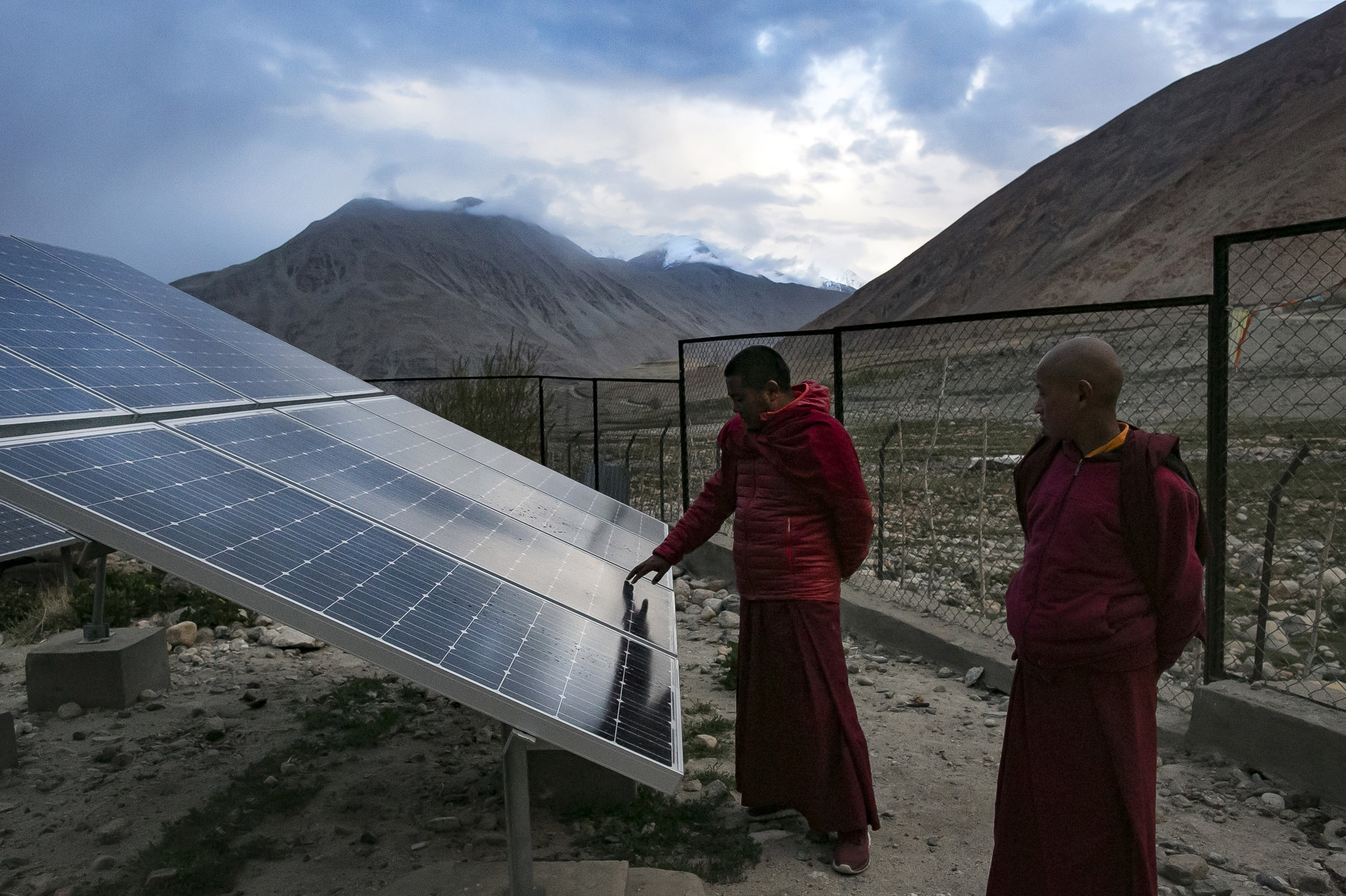 Monks touch solar panels at the Shachukul Monastery, of which the dormitory and school are reliant on solar energy, in Chosling village in Ladakh, India. Speaking two days after US President Donald Trump announced plans to withdraw from the Paris agreement on climate change, Indian Prime Minister Narendra Modi said that India was “part of the world’s shared heritage” and that India would “continue working...above and beyond the Paris accord”. India saw nearly $10 billion invested, both in 2015 and in 2016, in renewable energy projects.  (Photo by Allison Joyce/Getty Images)