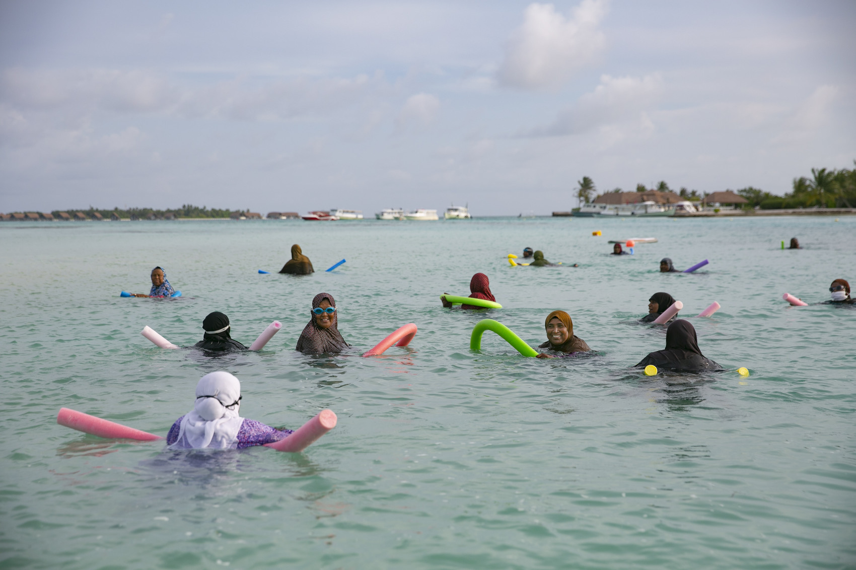Local women swim in the ocean in Guraidhoo, Maldives. The Maldives is one of the world's lowest-lying countries; more than 80% of the Maldives’ land is less than one meter above sea levels, making it extremely vulnerable to climate change. At current global warming rates, 80% of the Maldives could be submerged by 2050.  At the recent UN General Assembly, when discussing the threat of climate change, Maldives President Ibrahim Mohamed Solih said “There is no guarantee of survival for any one nation in a world where the Maldives cease to exist.” (Photo by Allison Joyce/Getty Images)