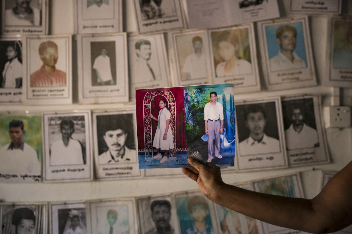 Patmanathan Kokilavani holds a photo of her two children at a protest site for loved ones of the disappeared in Mullaitivu, Sri Lanka. Patmanathan Kokilavani is missing her two children, Patmanthan Piratheepan and Patmanathan Tharsika. They were separated in a chaos of a bombing May 17 2009. She was detained in a refugee camp after the attack and was released September 2009, and then checked everywhere for them. She got confirmation that they were at one military camp but was denied access to see them. In 2016 a person from the military came to her home and told her that they were going to be released, but it didn't happen. {quote}Just show me my son and daughter once. You can keep them but just let me see them once and give me some peace. I'm spending all my money to find them, I can't sleep, I'm crying every day. I have no strength left. Keep them but please just show me their faces once time.{quote} 