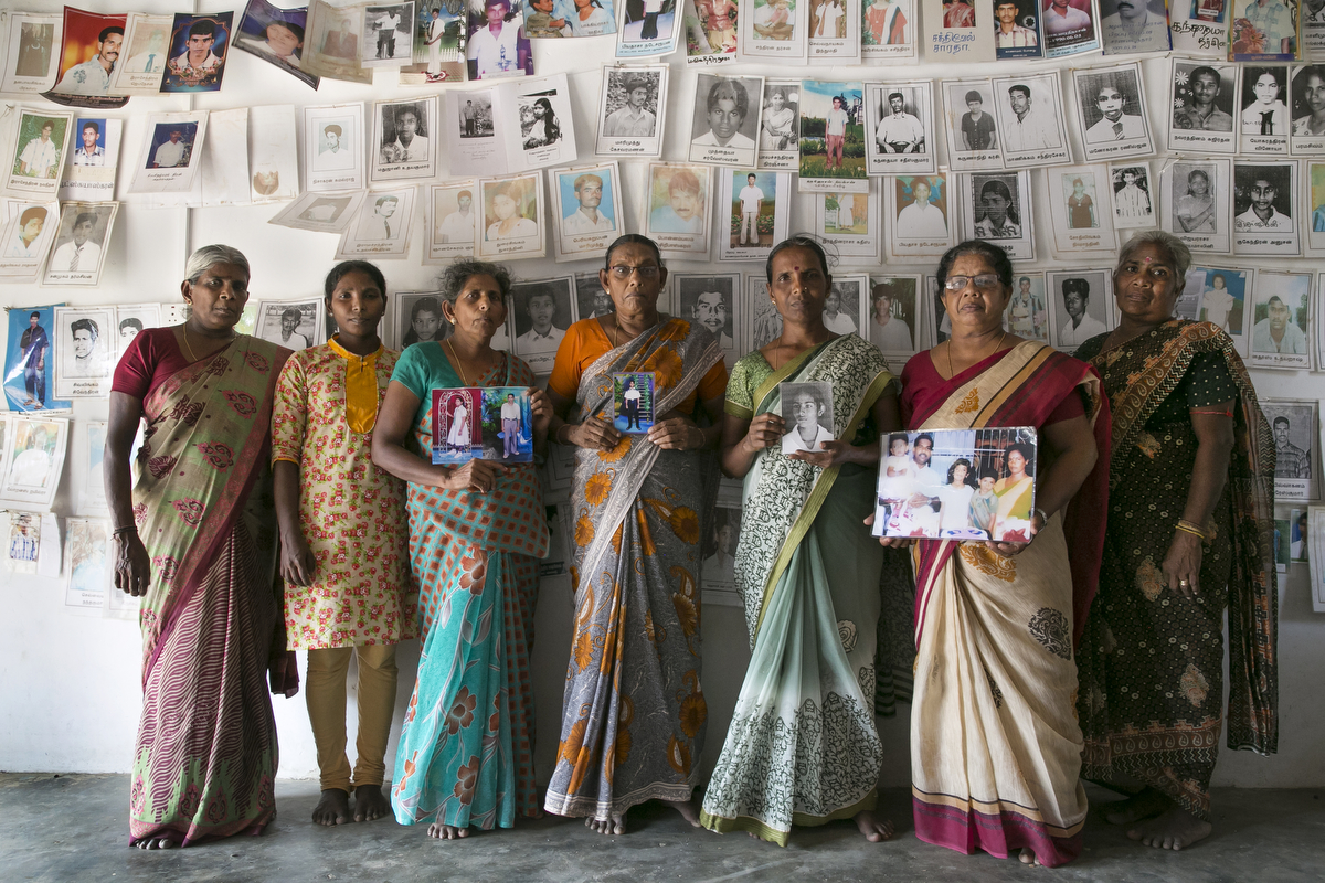 Women pose for a photo at a protest site for loved ones of the disappeared in Mullaitivu, Sri Lanka