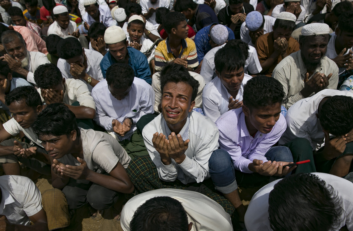 Rohingya refugees attend a ceremony organized to remember the second anniversary of the Rohingya crisis on August 25, 2019 