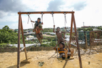 Kids swing in the camp