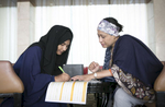Raze helps 18 year old Rohingya refugee Yasmin Akhter with her application to the Asian University for Women.Razia Sultana was born in Myanmar but is a Bangladesh citizen. She grew up in Chittagong in the tight knit Rohingya community. Her dream was always to be a barrister but after she was married her husbands family didn't approve of her studying further. {quote}My life is full of struggle{quote} She and her family were involved with the Rohingya activist groups ARNO and BRC, and in 2009 the Bangladesh government shut the organizations down. Two of her family members were put in jail and into exile abroad. {quote}The influx broke me totally. I was sick and traumatized and full of feat in my heart. I couldn't control myself. My friends and family asked me what I wanted and I said that I have to do something for women. That was the start. I gave up everything to work for my nation, to get them their rights, their human rights. What's been going on is wrong.{quote}  She has since trained hundreds of women in livelihood and literacy training. {quote}There is no life in the camps, they have become a burden for the world. If there is no skills training, no education, they will become subhumans! They’re deprived of all opportunities and denied a normal life. They will become desperate and you can't blame them or anybody , it's like you're creating a bomb! They're frustrated and cant think wrong or right. We have to prevent this, we have to solve the issue of going back, you cant keep them in Bangladesh, this isn't their land.”