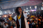 A festival goer dances during a live music event during the 124th annual Lalon festival in Kushtia, Bangladesh. The Lalon Shah festival is an annual festival celebrating the life and death of Fakir Lalon Shah, who was a Bangladeshi mystic, baul, philosopher, musician, writer and advocate of religious tolerance. Buddhists, Hindus and Muslims follow his teachings and attend the festival, which comprises of 3 days of music, dance, and consumption of marijuana, which is referred to as {quote}siddhi{quote}, or enlightenment. 