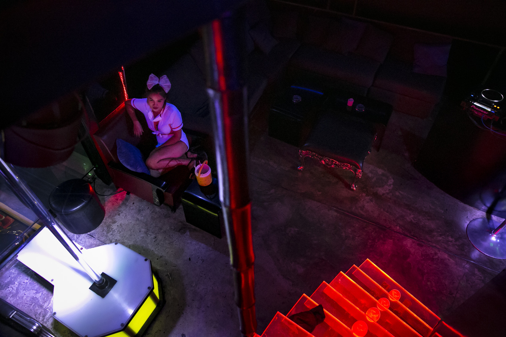 A girl waits for customers at a bar in the Patpong red light district in Bangkok, Thailand With entry into Thailand still restricted, and relatively few tourists able to enter, a good living has turned into a bad one for the country's sex workers.
