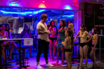 Girls entertain a customer at their bar in a red light district in Pattaya , Thailand With entry into Thailand still restricted, and relatively few tourists able to enter, a good living has turned into a bad one for the country's sex workers.