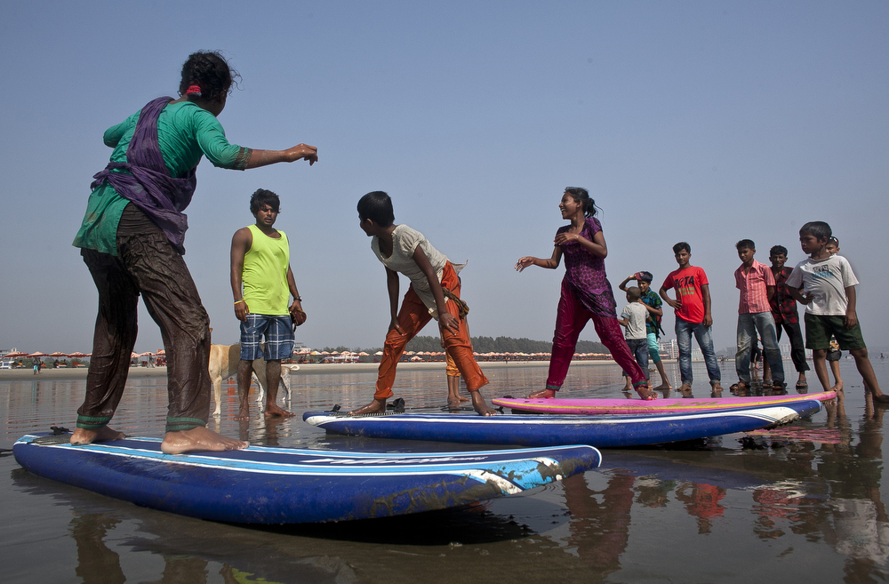 Rashed Alam teaches the girls to surf in in Cox's Bazar, Bangladesh in 2014