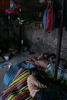 Vegetable vendors sleep at a nearly empty market on the first day of a renewed nationwide lockdown in Dhaka, Bangladesh.