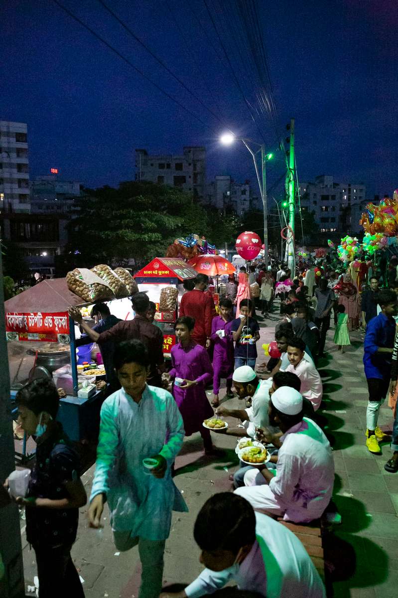  People socialize at a park on Eid day in Dhaka, Bangladesh.