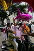  People look at balloons being sold outside mosque after prayers on Eid day, in Dhaka, Bangladesh.