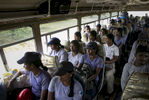 Female de-miners take the bus back to base after finishing a shift working at Muhamalai, one of the biggest minefields in the world