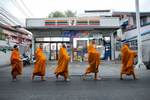 Buddhist monks wear face shields amid concerns over the spread of the COVID-19 as they collect alms in Bangkok, Thailand. Thailand has more than 1,500 confirmed COVID-19 cases and has entered a state of emergency in order to take stronger measures against the spread of the virus. (Photo by Allison Joyce/Getty Images)