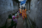 Women waits for customers at the Jessore brothel in Bangladesh