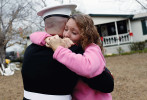 Pfc. Jason Barfield, a United States Marine, embraces his mother, Kelli Barfield, outside her home in Ashford Wednesday morning, December 16, 2010. Pfc. Barfield surprised his mother, who thought he wouldn't be home for Christmas, with the visit. On October 24, 2011, Barfield died while conducting combat operations in Helmand province, Afghanistan. On March 7, 2013, he was posthumously awarded the Bronze Star for heroism in combat.
