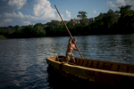Robert Schumacher uses a pole to guide the Lizzie Langley into the James River for the first time on May 18.