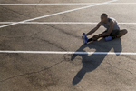 Stretching During Fitness Photoshoot shot by Austin, TX based professional photographer, Dennis Burnett