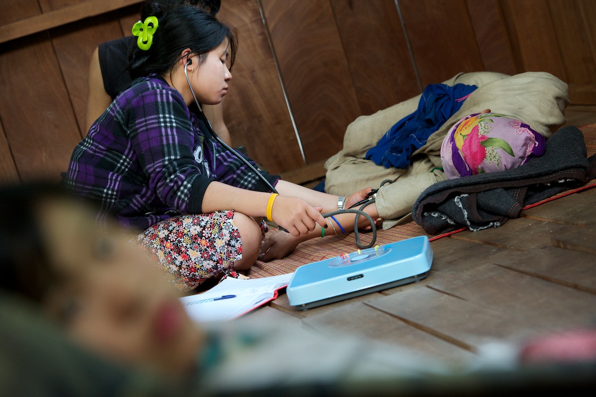 Naw Khu Khu Say, a medical student, checks vital signs of an in-patient at the Free Burma Ranger medical clinic at the Jungle School of Medicine Kawthoolei. Common diseases inside Burma include malaria, typhus, diarrhea with dehydration, dysentery, pneumonia, typhoid and minor and major trauma from daily life and the continuing conflict with the Burmese Army. 