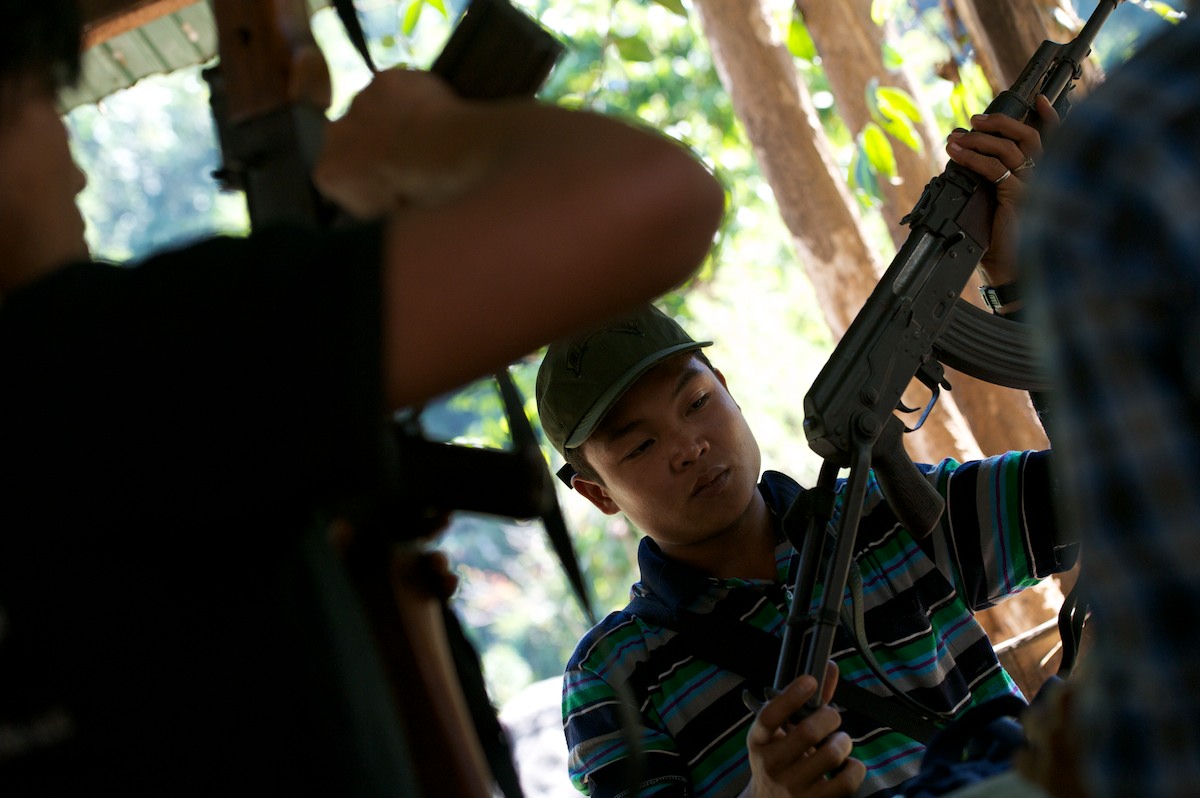 Free Burma Ranger staff and security check and inspect weapons and receive weapon handling training. 