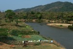 A typical farm scene along the seasonal banks of the Nam Lik River. The Nam Lik River is tributary to the Mekong River further downstream. 