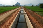 An Theun-Hinboun Power Company irrigation canal carries water from the Nam Hai River to the newly resettled Nongxong village farmland.