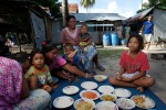 A group of Urak Lawoi' share a meal. Many Urak Lawoi' live among themselves in nuclear-type families, consider themselves kin, sharing resources and promoting each others success in times of need. 