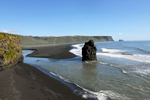 This is a photo of the beautiful black volcanic sand beaches in Vik, Iceland.