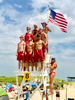 These lifeguards are singing The Star Spangled Banner on July 4th at Horseneck Beach in Westport, MA. An annual tradition on Independence Day. 