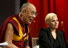The Dalai Lama chuckles during a panel featuring himself and Lady Gaga during The United States Conference of Mayors in Indianapolis, Indiana Sunday June 26, 2016. 