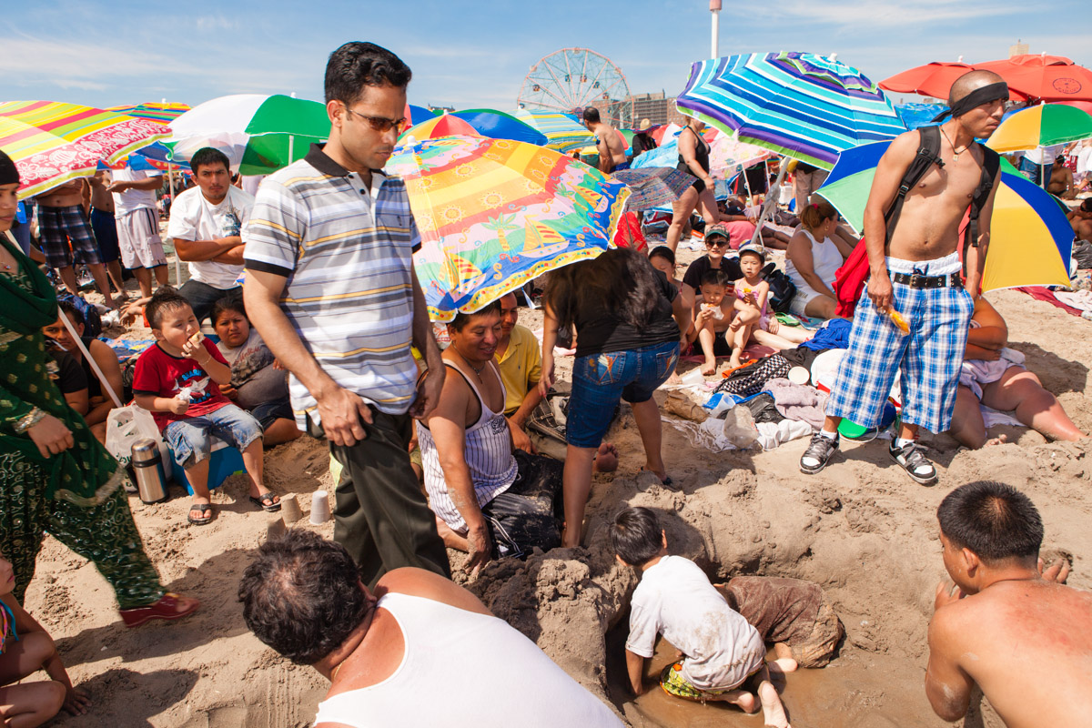 An estimated 75,000 people visited Coney Island on July 4th weekend, 2010. Beachgoers tend to crowd the area to the east of the Steeplechase Pier and directly across from the 90-year old Wonder Wheel, now a New York City landmark.
