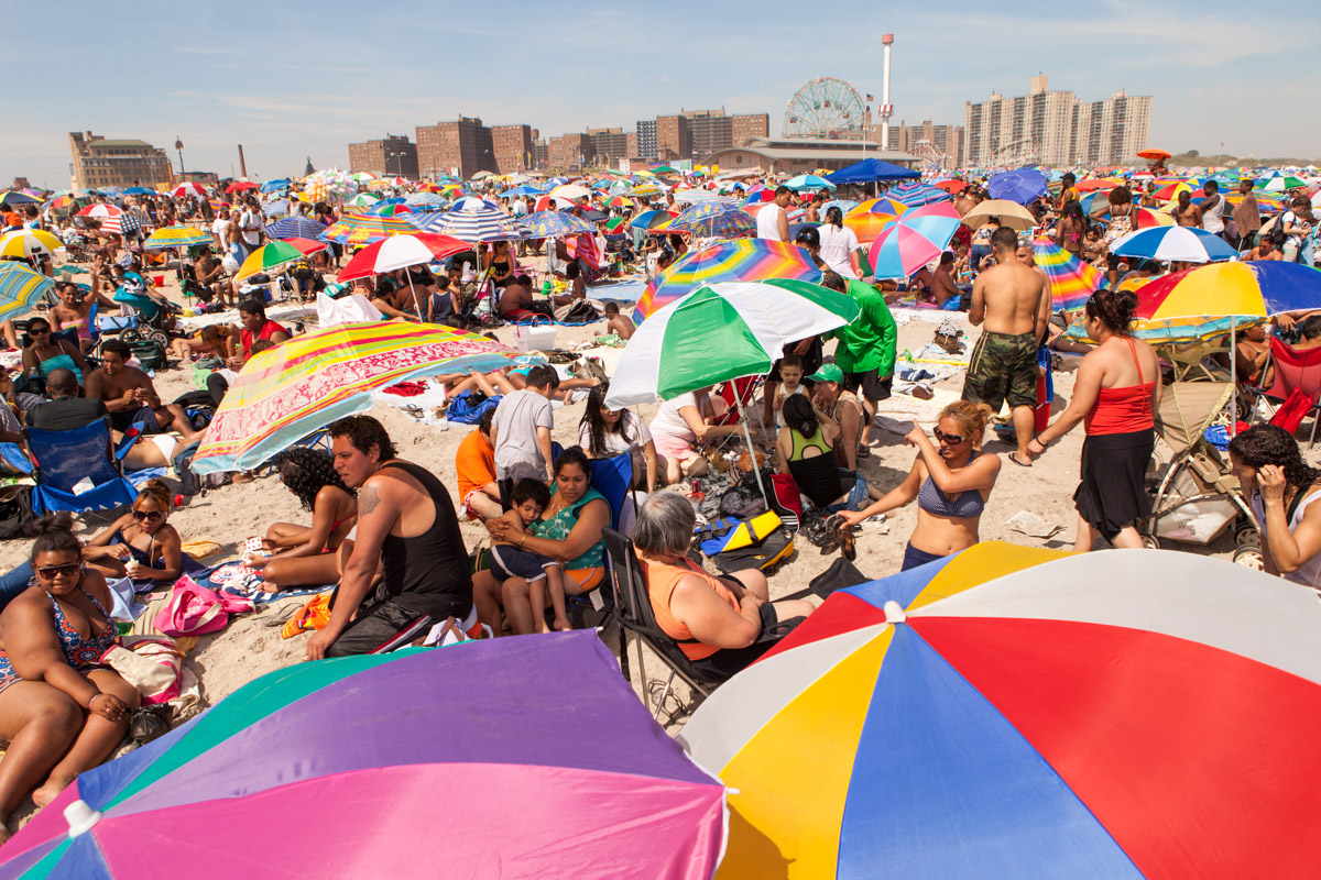 An estimated 75,000 people visited Coney Island on July 4th weekend, 2010. Beachgoers tend to crowd the area to the east of the Steeplechase Pier and directly across from the 90-year old Wonder Wheel, now a New York City landmark.