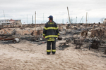 A fireman surveys the damage in Breezy Point, Queens following the fire that destroyed one hundred and eleven homes during Hurricane Sandy. November 1, 2012.