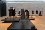 Balenciaga in Black at the Kimbell Museum was an overview of couturier Balenciaga’ s career from the 1940s to the 1960s. Over 100 pieces of hand made dresses were featured, including gowns, suits and accessories, all black. The goal of the exhibition design was to accentuate the various shapes, volumes, textures, and silhouettes of Balenciaga’ s timeless creations, and to encourage visitors to examine the exquisite detail in his work. Freestanding cases allowed for 36 0 degree, close-up viewing of the pieces, while cascading platforms enabled the composition of dramatic tableauxs. 