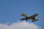 Colour aviation photograph of an A-10 Thunderbolt II Warthog heading right to left