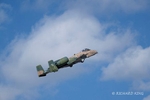 Colour aviation photograph of an A-10 Thunderbolt II Warthog climbing left to right