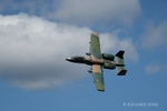 Colour aviation photograph of an A-10 Thunderbolt II Warthog heading right to left