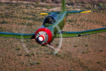 color image of a Nanchang CJ flying over the Arizona desert