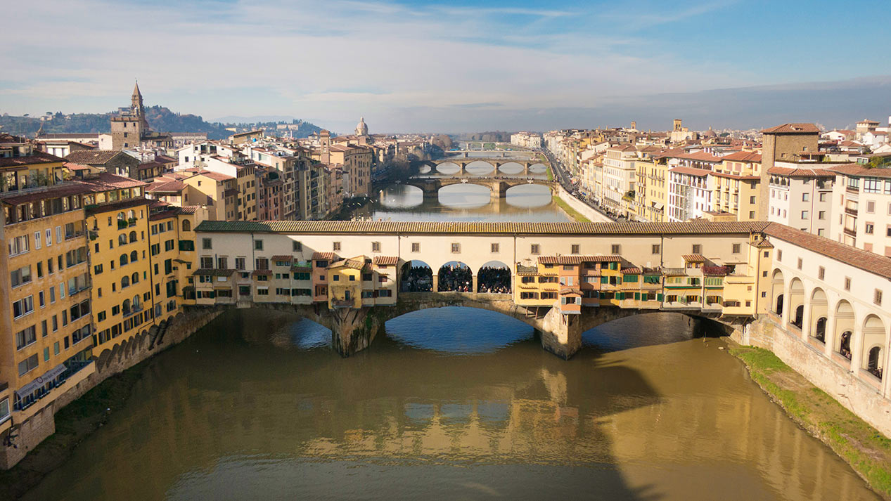 The Ponte Vecchio is a Medieval stone closed-spandrel segmental arch bridge over the Arno River, in Florence, Italy