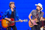 Mick Jagger of The Rolling Stones, left, performs with Brad Paisley at the Wells Fargo Center in Philadelphia.