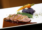 The roast duck with duck jus, haricots vert and an Okinawa sweet potato purée at Meritage Restaurant in Philadelphia.