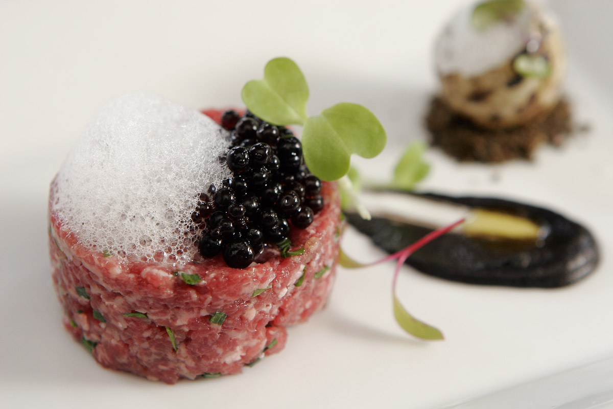 Beef tartare with balsamic vinegar spheres and caper {quote}air{quote} at Bocca restaurant in Philadelphia.
