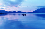 A fisherman at dawn on Lake Atitlán, Guatemala.