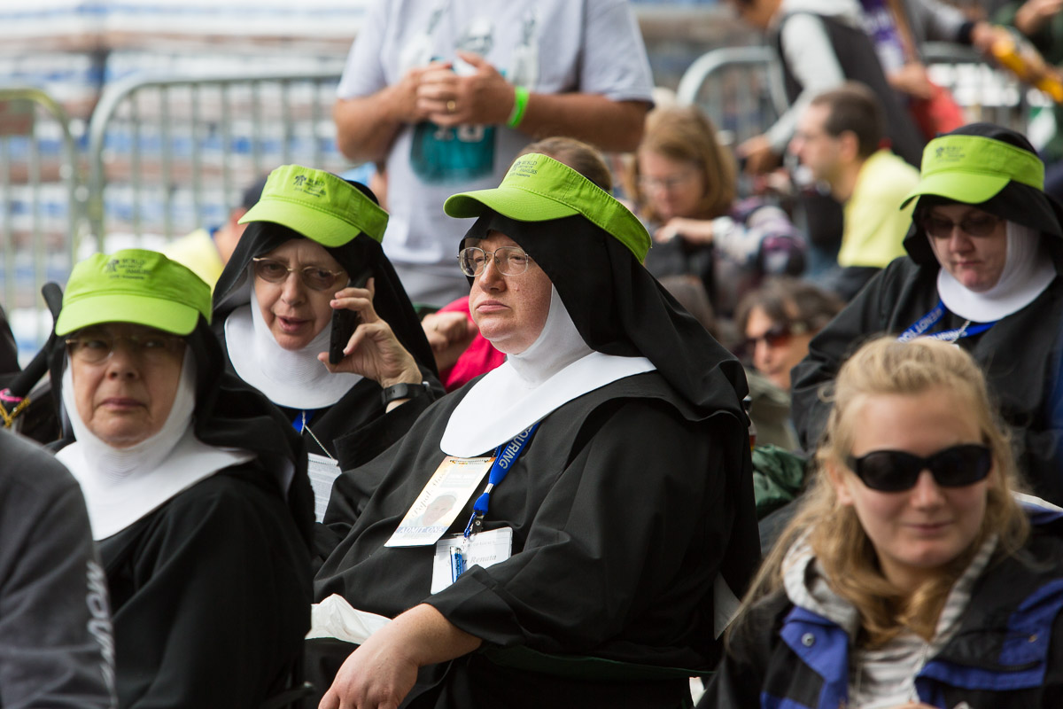 A group of nuns wait for mass led by Pope Francis to begin on the Ben Franklin Parkway in Philadelphia.
