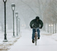 A cyclist pedals through a heavy snowstorm in Philadelphia.