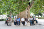 Men sit outside a mosque in Amasya, Turkey.