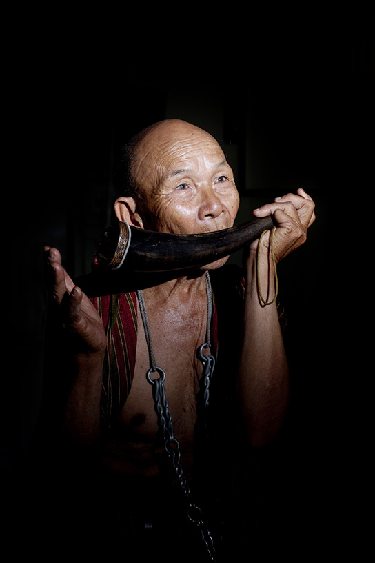 Boon Ma, a Mor Chang, or elephant shaman, poses in Ban Ta Klang. He is one of the last 4 remaining Mor Chang and a spiritual leader of the Kui people.